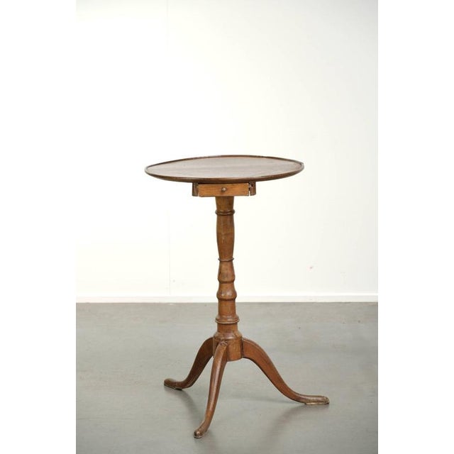 This antique English side table/wine table dates from the 19th century and features a unique drawer and beautiful colors....