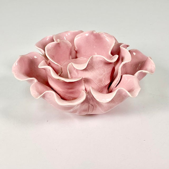 This Knife Cut Ceramic low rise table top candleholder is a Pink Lotus flower with layers of petals. The design features a...