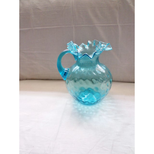 This is a Antique Northwood Hand Blown Blue Coin Dot Pitcher with Rare Blue Ribbed Handle that is 9" tall and has no Chips...