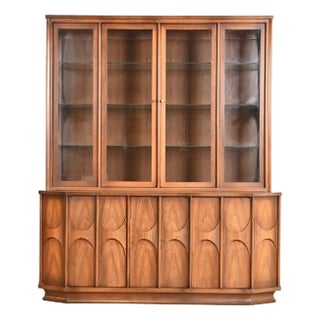 Kent Coffey Perspecta Mid-Century Modern Sculpted Walnut Lighted Breakfront Bookcase or Display Cabinet, 1960s For Sale