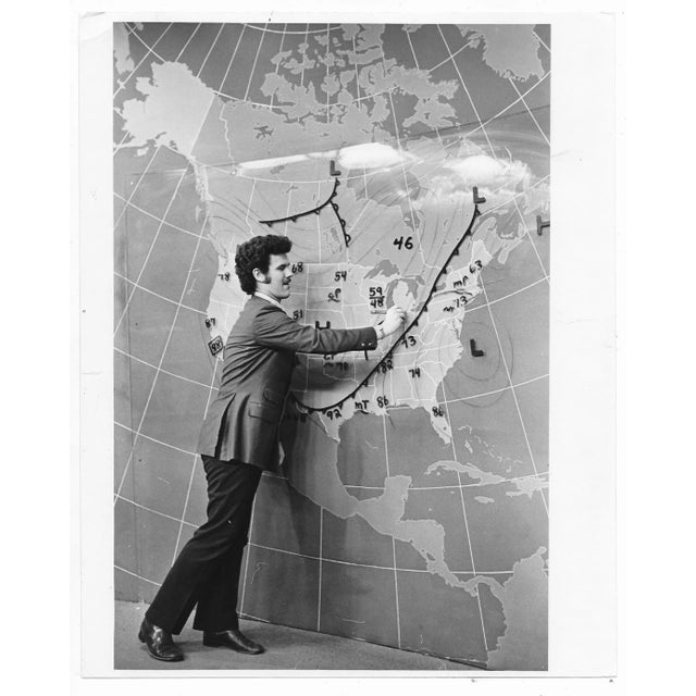 1972 black & white press photo of Minneapolis weatherman Walt Lyons wearing his "Anchorman" best. Marked on back.