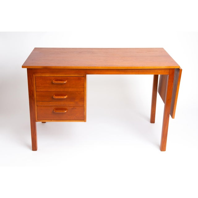 Teak Danish modern sliding top desk with 3 drawers (In the style of Arne Vodder / Attributed to Domino Møbler). Space...