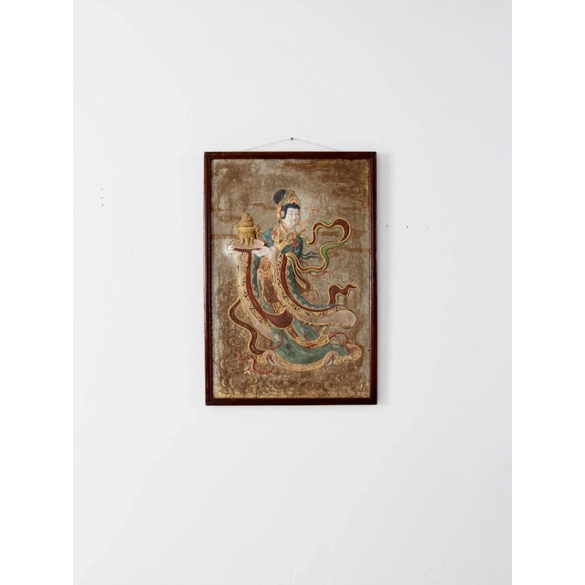 This is a vintage Chinese plaster wall sculpture. Picturing a female deity, the raised relief painting is aswirl with warm...