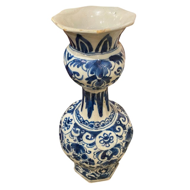 A large 18th Century Delft Knobble vase with hand painted blue and white floral design.