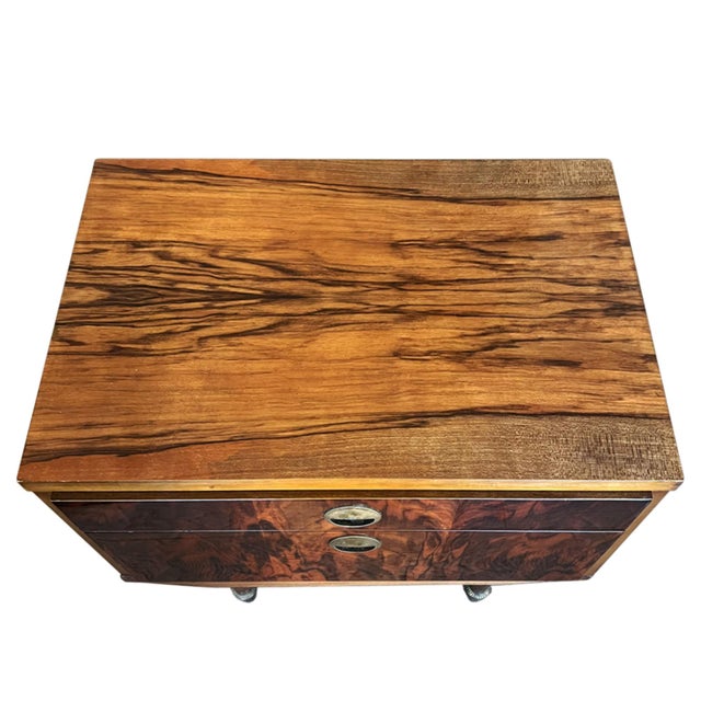 A gorgeous pair of nightstands, made in Italy in the 1960s. Beautifully made with fine veneer and stylish brass handles....