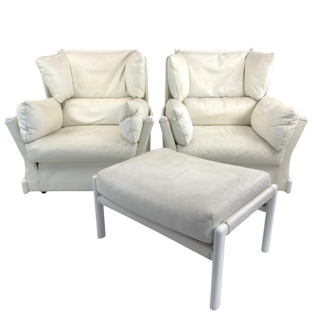 Dimensions: H 38.5” x W 36.2” x D 35.4” x SH 15.7” (ottoman) H 16” x W 28.7” x D 20.8”. Pair of Italian white leather...