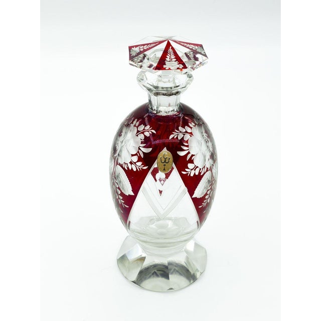 Bohemian glass carafe is a wonderful colored glass piece realized in the second half of 20th century. With round base,...