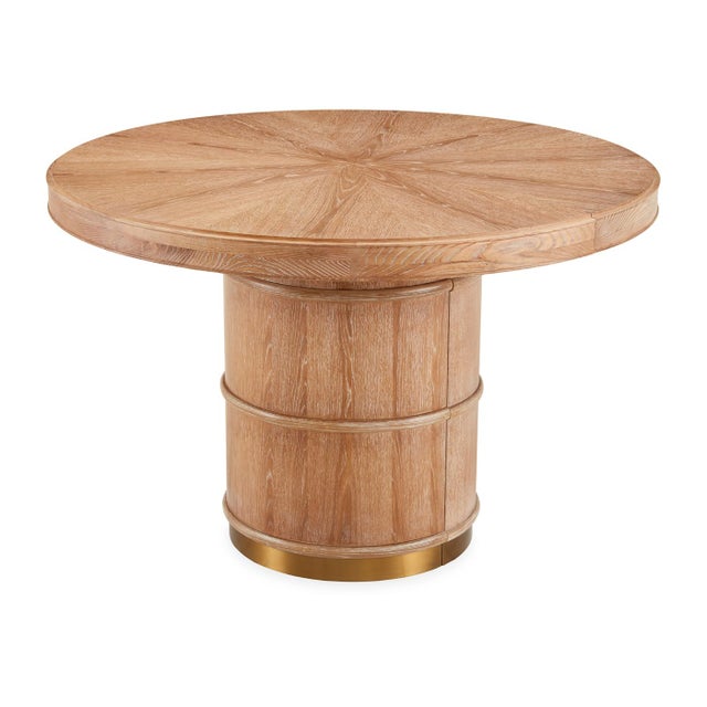A hardworking wire-brushed and lightly limed solid oak tabletop with a radial pattern on a bamboo-inspired, brass-banded...