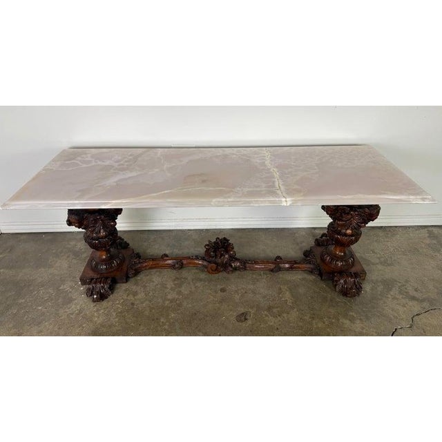 A monumental and sculptural European Baroque Revival coffee table, dating to the late 19th to early 20th century (circa...