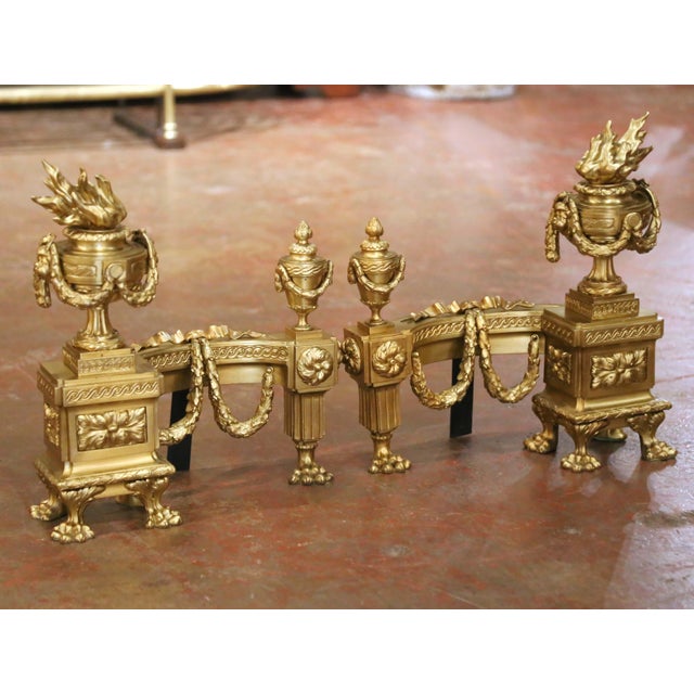 This finely cast pair of antique fireplace chenets brings impressive architectural detail and refined Louis XVI elegance...