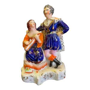 Staffordshire Figure of Girl Playing Musical Instrument