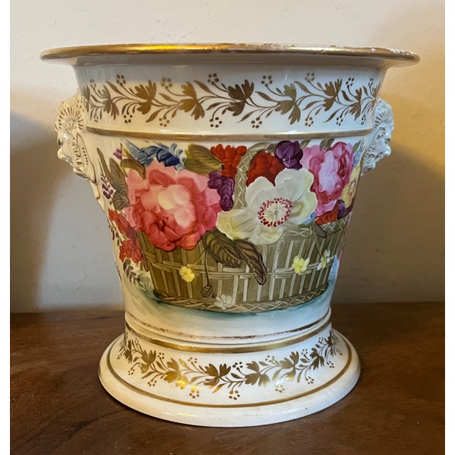 Pair antique early 19th century English porcelain cachepot flower pots with satyr mask handles and flared rims. Decorated...