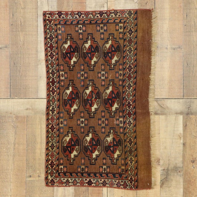antique Tekke Yomud Yomut Saryk Chuval rug Bag Face. This antique Tekke Yomud Chuval rug bagface features nine large...