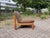 Mid-Century Vintage Easy Chair in Teak-Stained Beech Featuring a thick, durable brown wool upholstery. The chair combines...