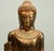 Impressive Burmese giltwood standing Buddha statue, circa 1950, finely carved and richly decorated in the traditional...