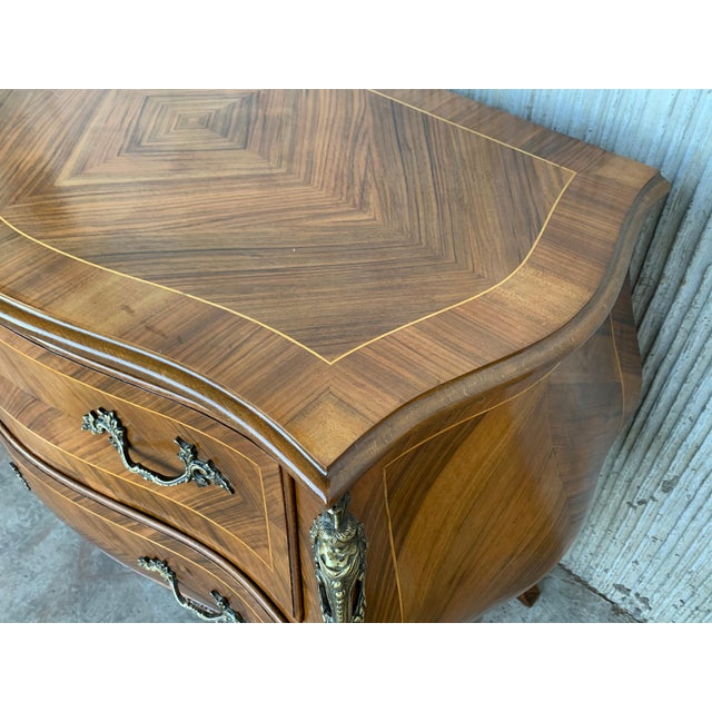 French Louis XV style kingwood veneer commode, the shaped marble top above a bombe case with ormolu bronze mounts, highly...
