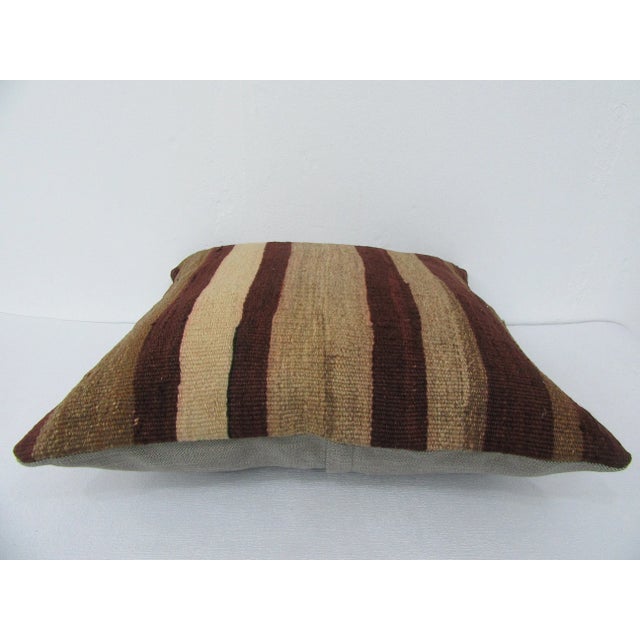 This is a pillow cover made from a vintage kilim rug. The piece was properly washed and ready to use. Pillow inserts not...