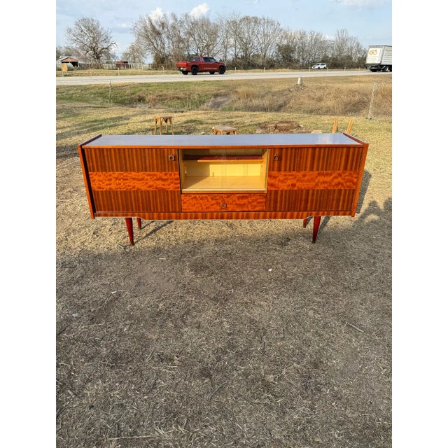 French art deco ''Sunburst'' sideboard. The sideboard is in very good condition, 2 doors sideboard, one drawer plus two...