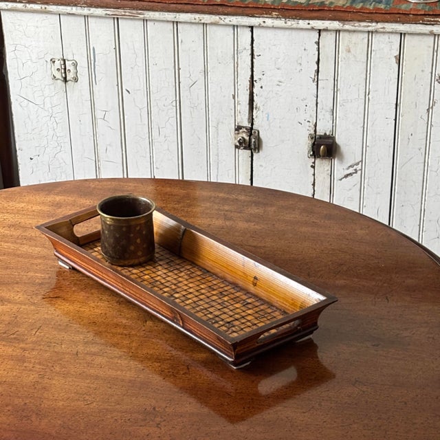Vintage British Colonial style long bar tray measuring 17.5" L x 6.5" W x 2.5" H. Features a beautiful honey-toned...