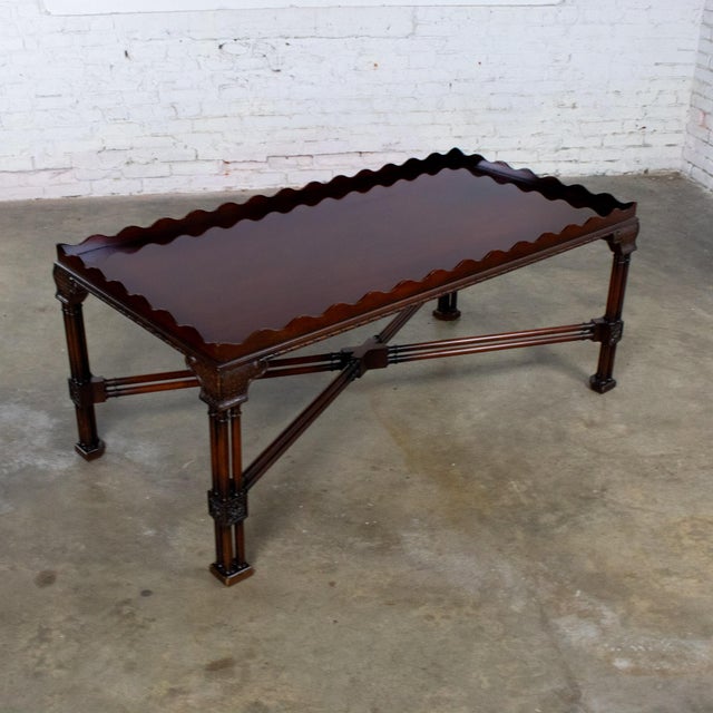 Handsome vintage Chinese Chippendale style coffee table by Baker Furniture composed of a large rectangular mahogany frame...