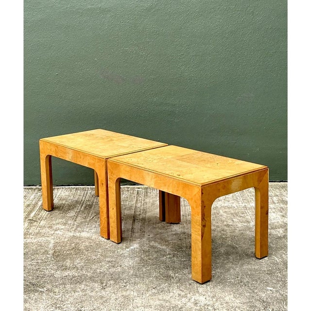 This pair of vintage burl wood side tables presents a clean, architectural silhouette, with a rectangular top resting on...
