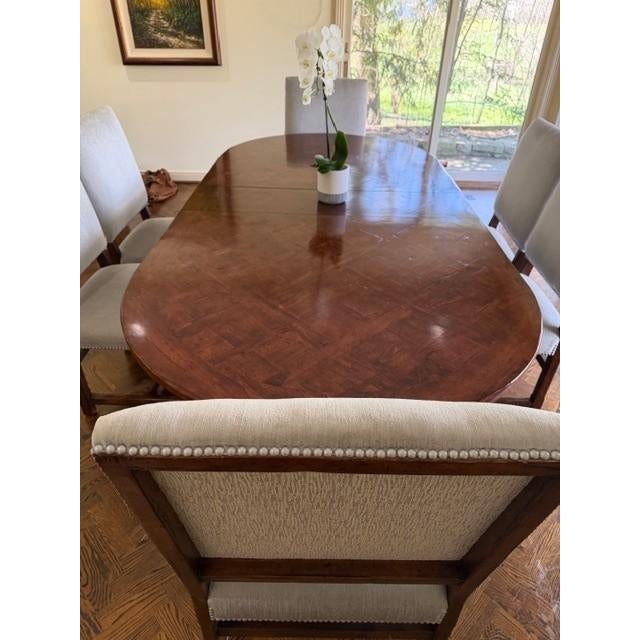 Elegant Solid Wood Dining Table with Upholstered Chairs – Set Beautiful and well-crafted dining set featuring a rich,...