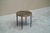 A wonderful and beautifully patinated side table in wrought iron, gilded metal and verre élogmisé. Most probably French,...