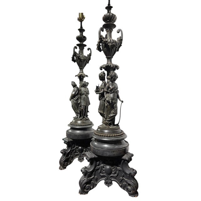 An impressive pair of 19th Century patinated bronze figural lamps originally from a jewelry store in New York city. One...