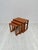 Beautiful vintage set of 3 danish nesting tables from the 1970s. Elegant mid-century design with warm teak wood grain and...