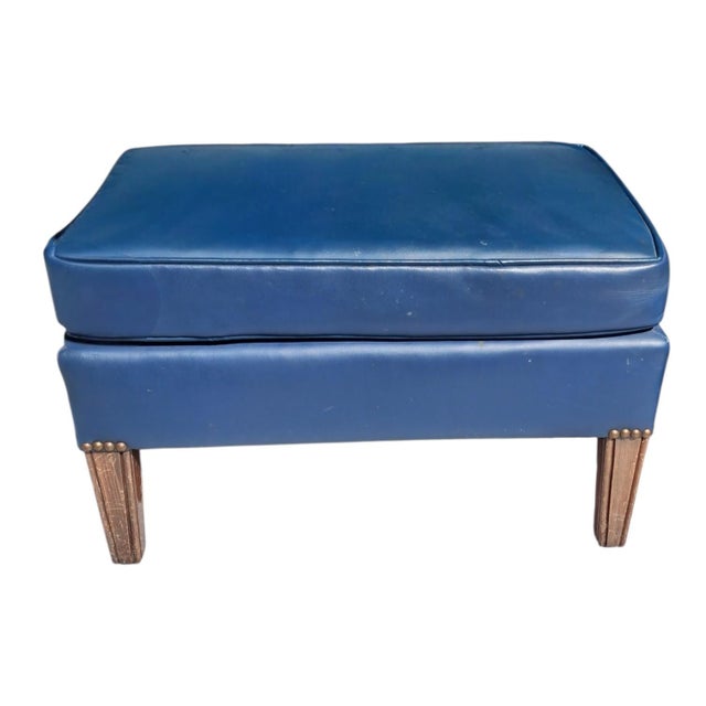 Step back into mid-century elegance with this stunning vintage lounge chair and matching ottoman set. Wrapped in rich,...