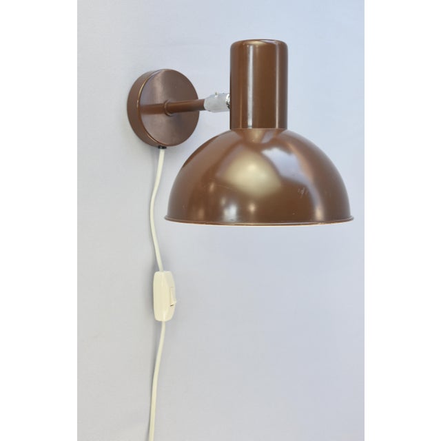 A rare Bunker wall lamp designed by Jo Hammerborg for Fog & Mørup, Denmark, dating from the 1960s. The Bunker was produced...