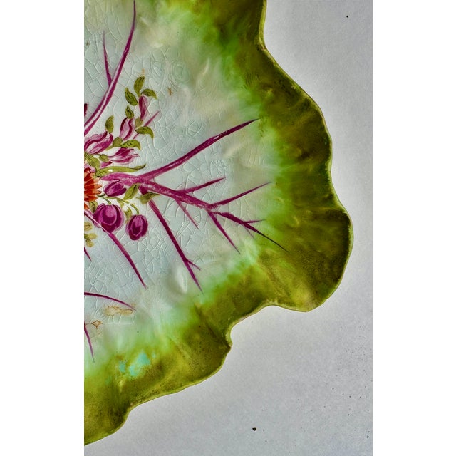 Mid 18th Century Chelsea Porcelain leaf-form dessert dish decorated with a Rococo floral bouquet. The underside bears the...