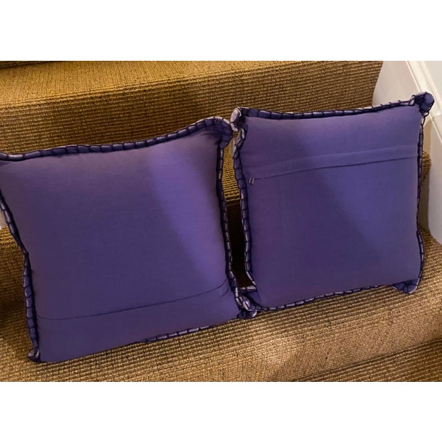 Pair of lavender pillows with flange and purple back with zipper. Flange has stitching as shown.20 x 20. Includes pillow.