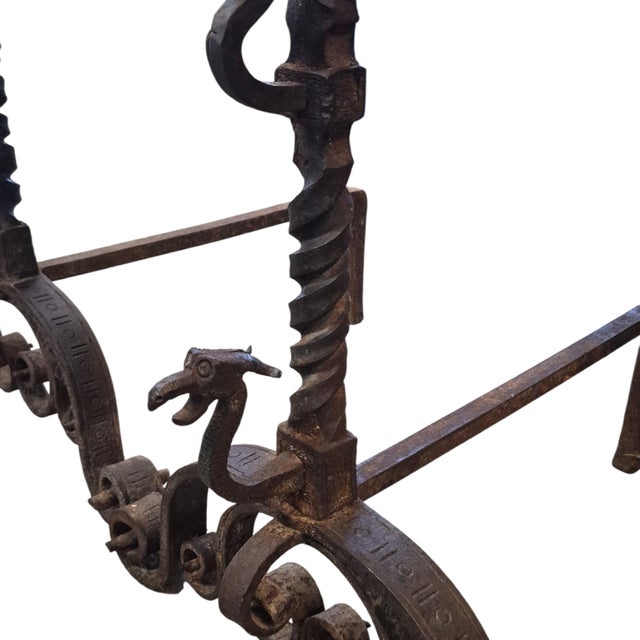 A palatial pair of Spanish wrought iron andirons measuring 37" h x 22" w x 25" deep.circa 1830.