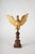 A magnificent carved and gilded wooden eagle with a turned walnut base. Made in italy. Date: 1800s. Dimensions: eagle: l...