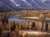 "Changing Colors" is an oil on panel landscape painting by Seth Winegar, completed in 2026. A river curves through a...