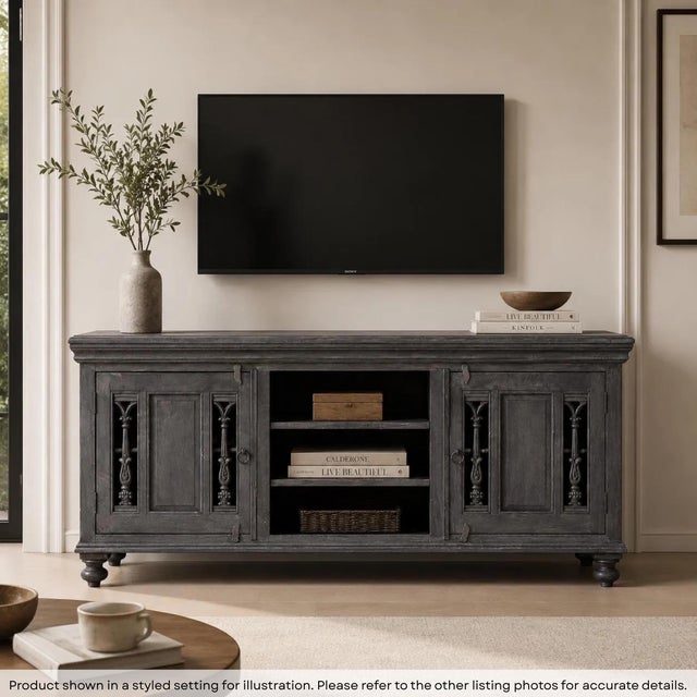 Dimensions: 69" W x 18" D x 32" H Give your home a grand and stately feel with this majestic two-door media console that...