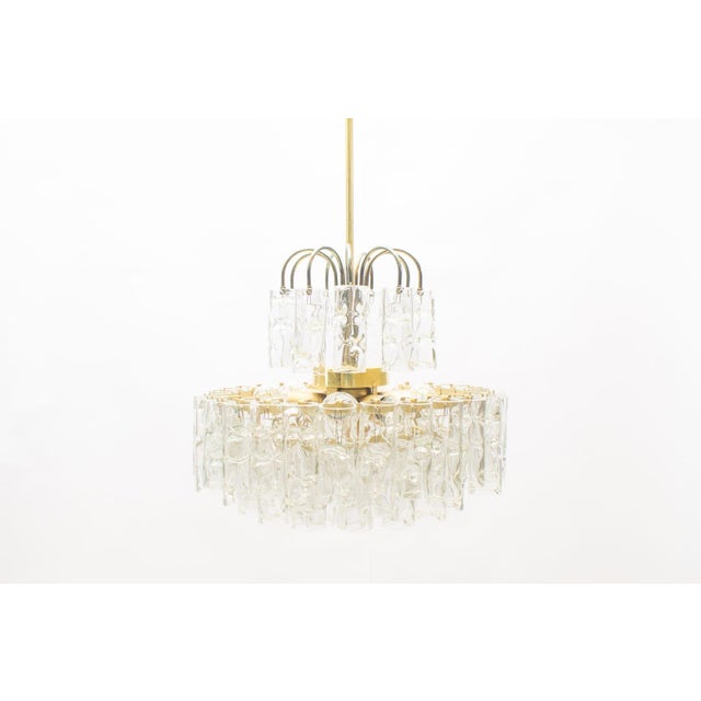 This chandelier features a total of 62 glass tubes and is equipped with E14 sockets. This piece has an attribution mark, I...