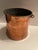 Vintage 19th-century copper and brass bucket, frequently used as a decorative fireside log or kindling bin. Originally...