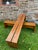 These two beautifully crafted wooden benches exemplify a refined and timeless simplicity. Each bench, composed of three...