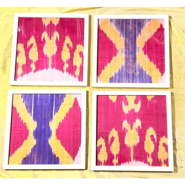 stunning one-of-a-kind Antique collection of four framed silk ikat textiles. These pieces are more than just wall art;...