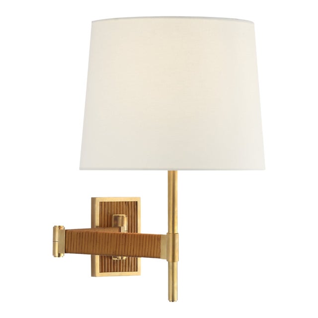 Suzanne Kasler for Visual Comfort Signature Elle Swing Arm Sconce in Hand-Rubbed Antique Brass & Dark Rattan with Linen Shade For Sale