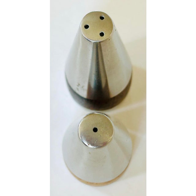 Set of MCM Danish-made salt and pepper shakers. Carved from solid Brazilian rosewood with exceptional woodgrains and...