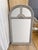 Elegant vintage 1070s arched mirror with a distressed gray wood finish, carved shell detail, and architectural divided...