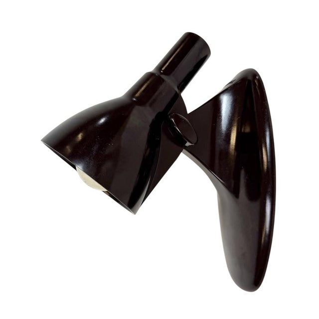 Vintage industrial dark brown bakelite wall lamp with adjustable lampshade was made by Elektrosvit in former...