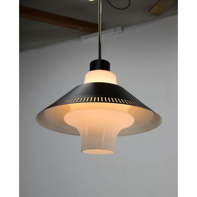 Mid-century glass and black painted metal pendant. Restored: new black paint on a metal shade. Rewired: 1x60W,...