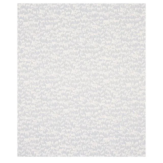 Miniature herds of hand-drawn deer, each with a distinct expression, give this small-scale and slate blue fabric design...