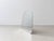 A distinctive, freestanding mirror with a softly rounded, asymmetrical shape and a minimalist design. The frameless mirror...
