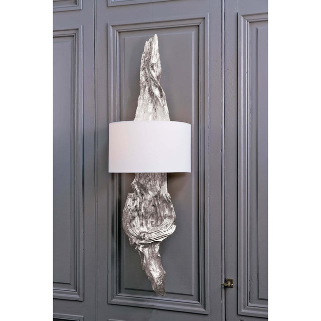 Wow your guests with this sconce installed as a pair in a bathroom or bedroom. Ambered Silver Leaf covers a driftwood-...