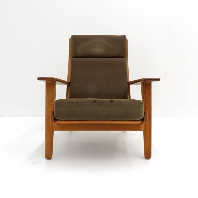 Wonderful high back lounge chair GE290A by Hans J Wegner for GETAMA, solid oak frame with nice patina and original...